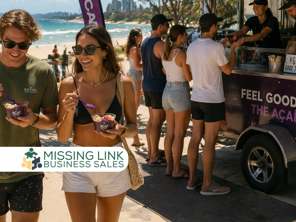 A smiling young man and woman enjoy açaí bowls on a sunny beach near a "Feel Good" açaí food truck, with a "Missing Link Business Sales" logo in the bottom left corner.